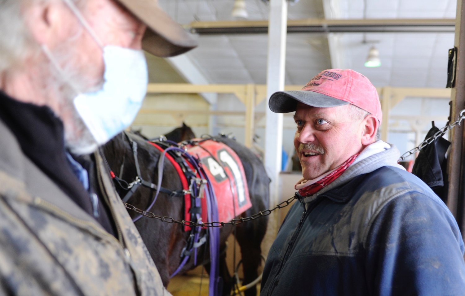 Horse sense. Philip “Bo” Sowers Jr., pictured right, has been in the sport of harness racing since he was five years old. He was just named Monticello Raceway’s 2020 Trainer of the Year. He is pictured with his barn manager Steve Shorey and the horse, I Saw Red...